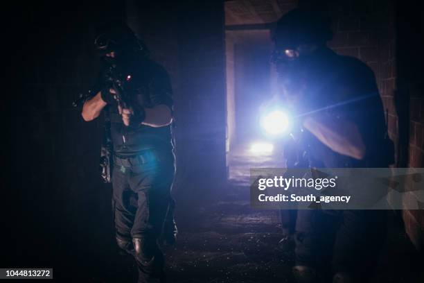 police team making an action - military uniform close up stock pictures, royalty-free photos & images