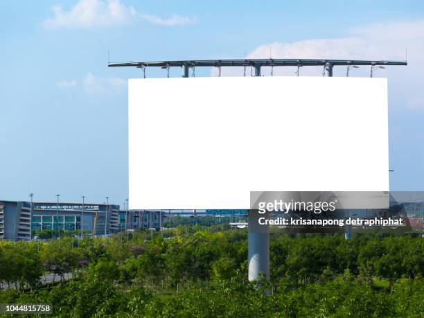 blank billboard at blue sky background - billboard 2017 stock-fotos und bilder
