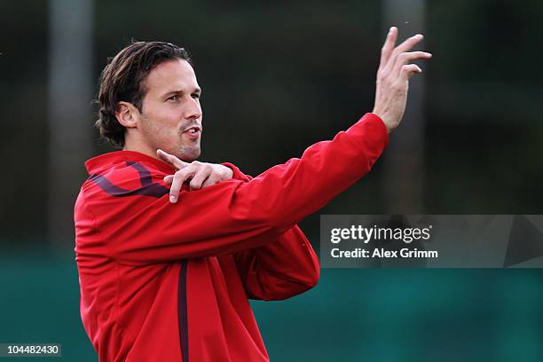 Marco Streller gestures during the training session of FC Basel at a local training ground ahead of their Champions League first round match against...