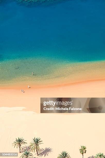 tourists walking on playa de las teresitas - playa de las teresitas stock pictures, royalty-free photos & images