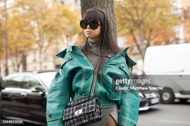 Leaf Greener is seen on the street during Paris Fashion Week SS19 wearing Miu Miu on October 2, 2018 in Paris, France.