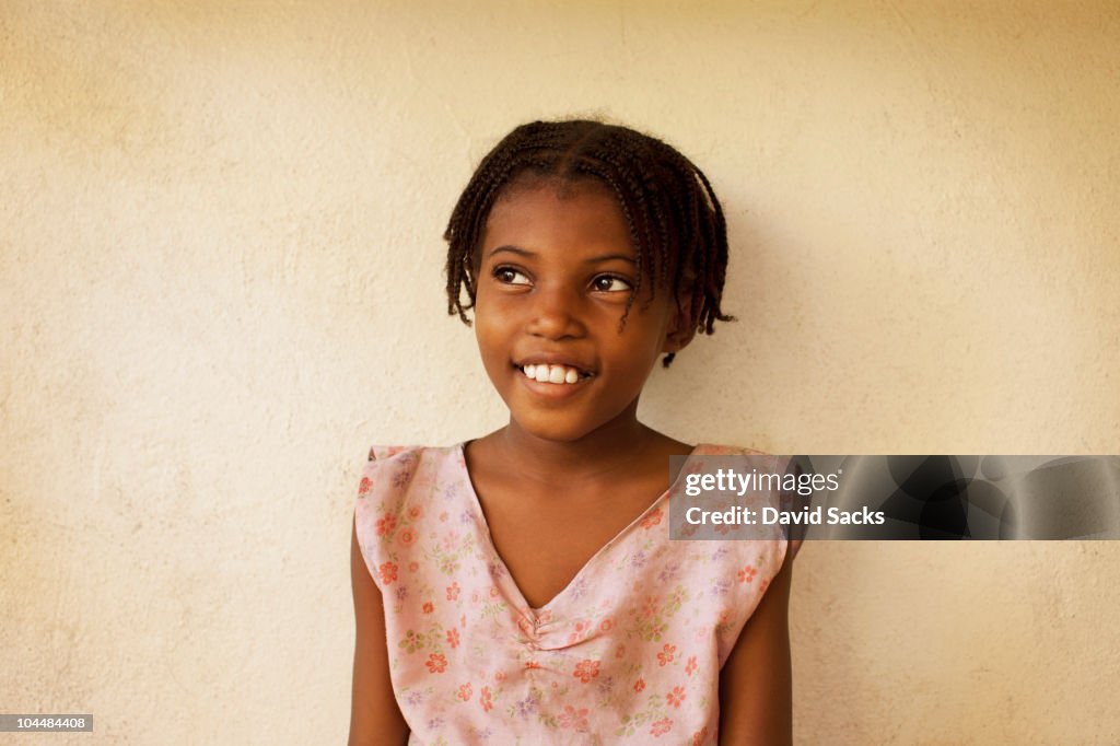 Young girl smiling outside of school