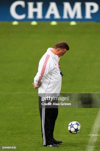 Head coach Louis van Gaal watches a ball during the training session of Bayern Muenchen at the St. Jakob Park stadium ahead of their Champions League...