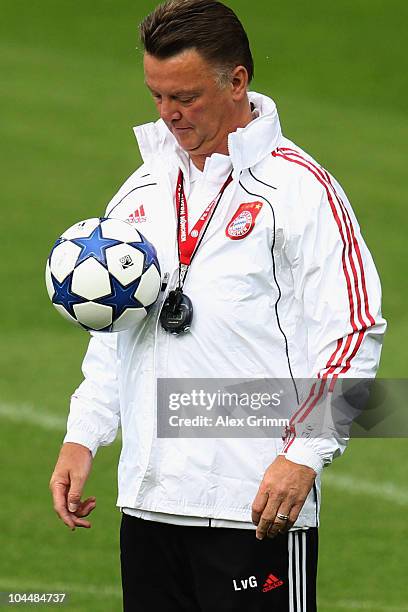 Head coach Louis van Gaal juggles with the ball during the training session of Bayern Muenchen at the St. Jakob Park stadium ahead of their Champions...