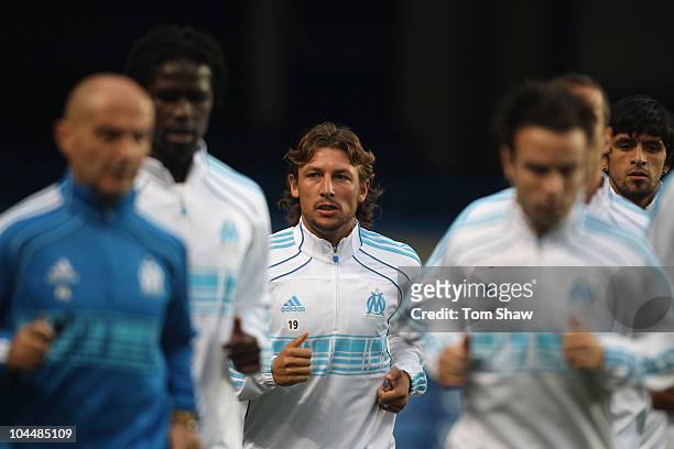 Gabriel Heinze of Marseille jogs during a training session ahead of their UEFA Champions League Group F match against Chelsea FC at Stamford Bridge...