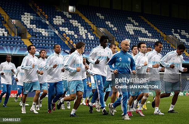 The Olympique Marseille squad running during a team training session at Stamford Bridge in Chelsea, in London on September 27, 2010. Olympique...