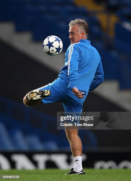 Marseille coach Didier Deschamps controls the ball during a training session ahead of their UEFA Champions League Group F match against Chelsea FC at...