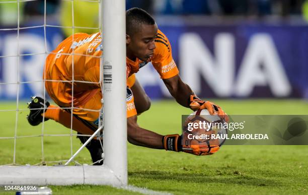 Colombia's Millonarios goalkeeper Wuilker Farinez stops the ball, during their Copa Sudamericana football match against Colombia's Independiente...