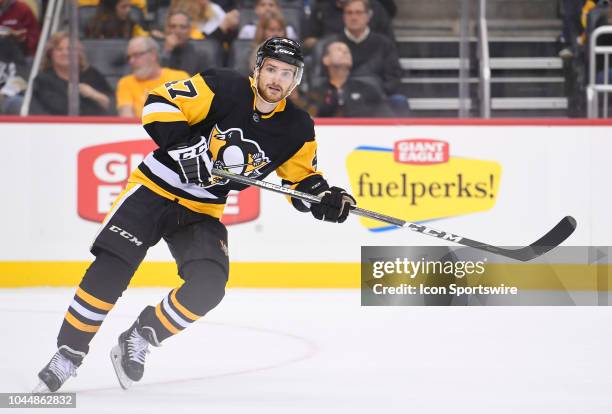 Pittsburgh Penguins center Adam Johnson skates during the first period in the preseason game between the Pittsburgh Penguins and the Columbus Blue...