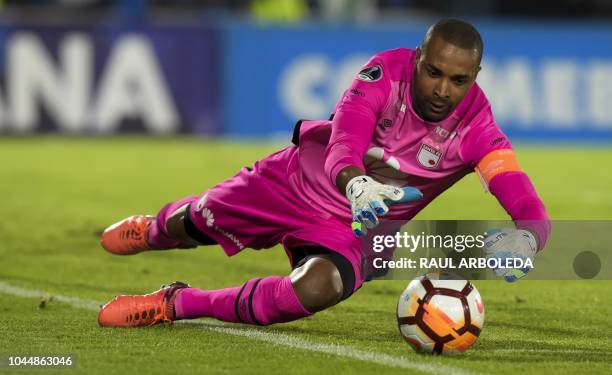 Colombia's Independiente Santa Fe goalkeeper Robinson Zapata dives to stop a ball during their Copa Sudamericana football match against Colombia's...