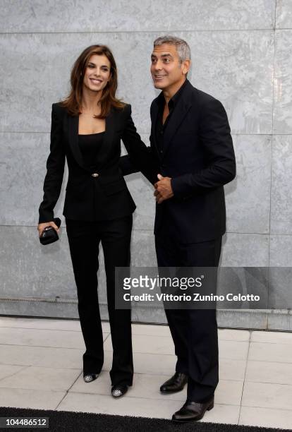 Elisabetta Canalis and George Clooney attend the Giorgio Armani Spring/Summer 2011 fashion show during Milan Fashion Week Womenswear on September 27,...