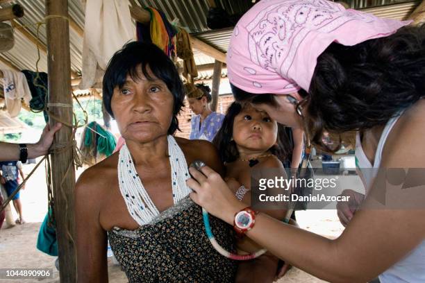 physician providing humanitarian help in remote regions - venezuela stock pictures, royalty-free photos & images