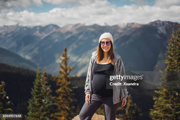 pregnant woman enjoying the view in aspen, colorado - european best pictures of the day september 26 2017 stock pictures, royalty-free photos & images