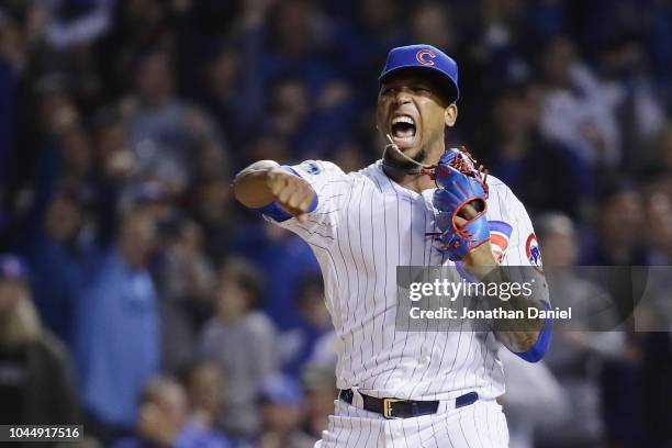 Pedro Strop of the Chicago Cubs reacts after striking out Ian Desmond of the Colorado Rockies in the ninth inning during the National League Wild...