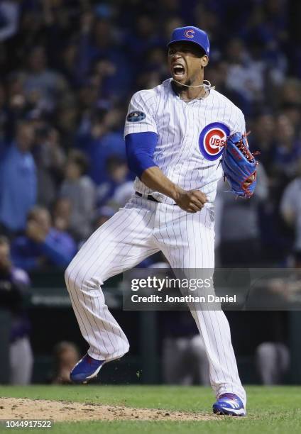 Pedro Strop of the Chicago Cubs reacts after striking out Ian Desmond of the Colorado Rockies in the ninth inning during the National League Wild...