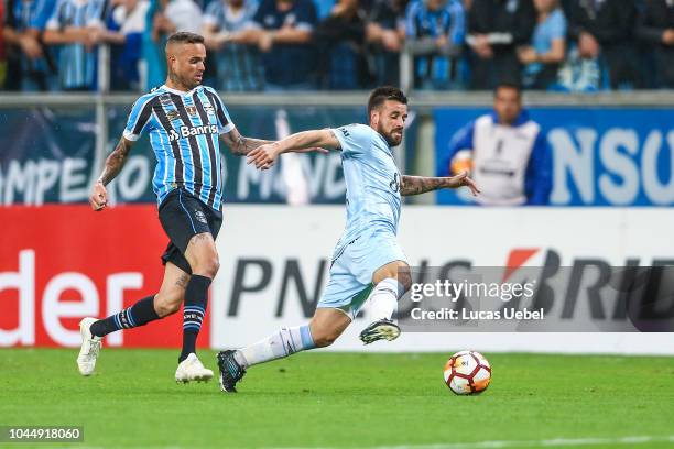 Luan of Gremio battles for the ball against San Roman of Atletico Tucuman during the match between Gremio and Atletico Tucuman, part of Copa Conmebol...