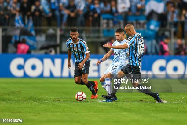 Thaciano of Gremio battles for the ball against Barbona of Atletico Tucuman during the match between Gremio and Atletico Tucuman, part of Copa...