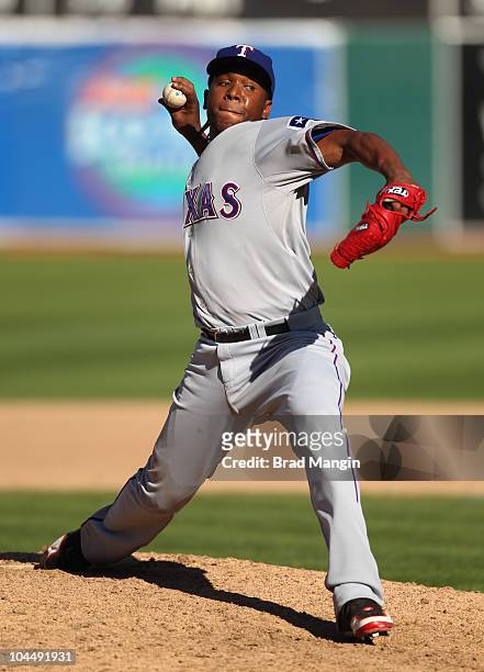 Neftali Feliz of the Texas Rangers pitches during the game between the Texas Rangers and the Oakland Athletics on Saturday, September 25 at the...
