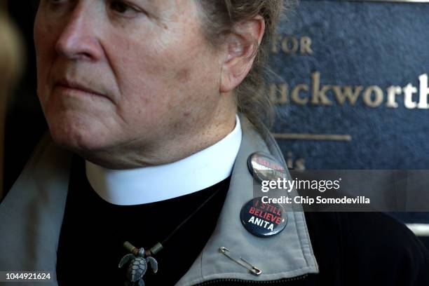 Dozens of other protesters gather outside the offices of Sen. Lisa Murkowski while demonstrating against the appointment of Supreme Court nominee...