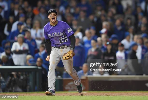 Nolan Arenado of the Colorado Rockies celebrates defeating the Chicago Cubs 2-1 in thirteen innings to win the National League Wild Card Game at...