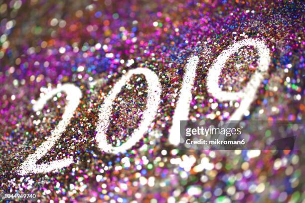 2019 happy new year background multicoloured  glitter - new year new you 2019 stock pictures, royalty-free photos & images