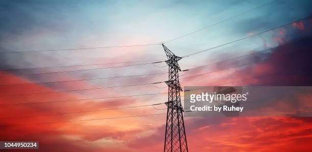 high voltage transmission tower at sunset - power of tower stock pictures, royalty-free photos & images