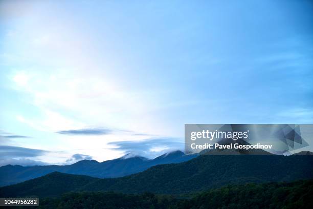 shiretoko mountain ridge and national park covered by clouds in hokkaido, japan - shiretoko stock pictures, royalty-free photos & images
