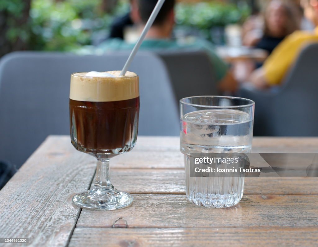 Freddo Espresso coffee and a glass of cold water