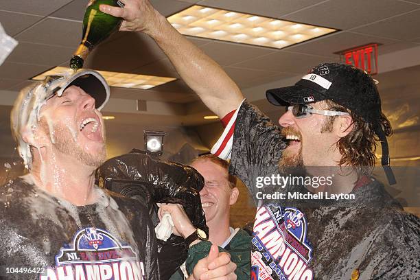 Roy Halliday and Jayson Werth of the Philadelphia Phillies celebrate clinching the National League East Title after a baseball game against the...