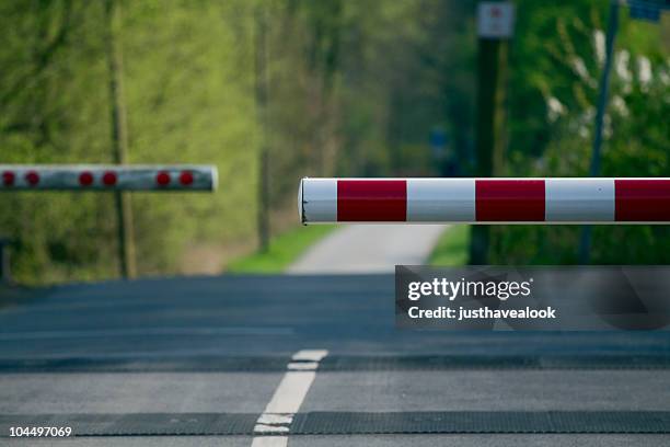 railway crossing - barricade stockfoto's en -beelden