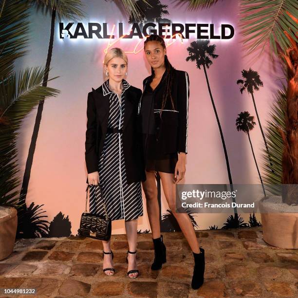 Caro Daur and Cindy Bruna celebrate the launch of the Karl x Kaia collaboration capsule collection, on October 2, 2018 in Paris, France.