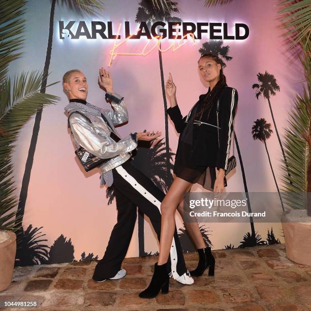 Dilone and Cindy Bruna celebrate the launch of the Karl x Kaia collaboration capsule collection, on October 2, 2018 in Paris, France.