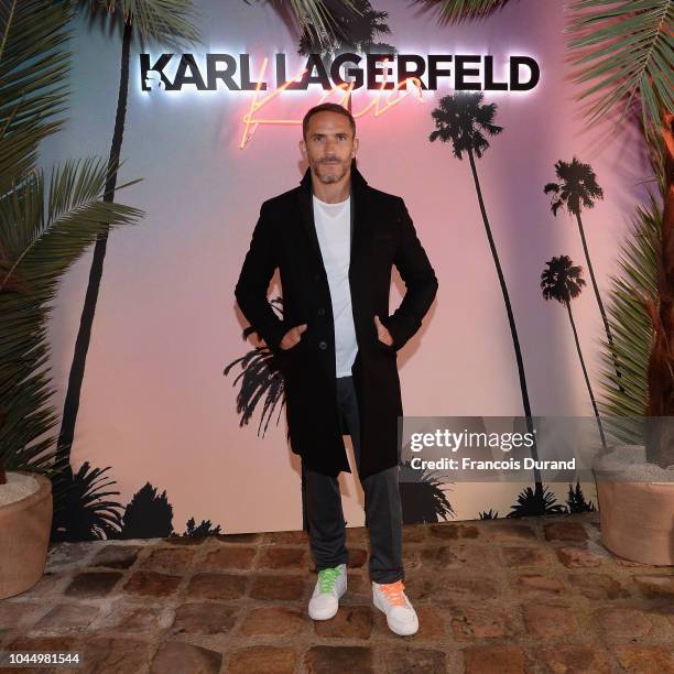 Guest celebrates the launch of the Karl x Kaia collaboration capsule collection, on October 2, 2018 in Paris, France.