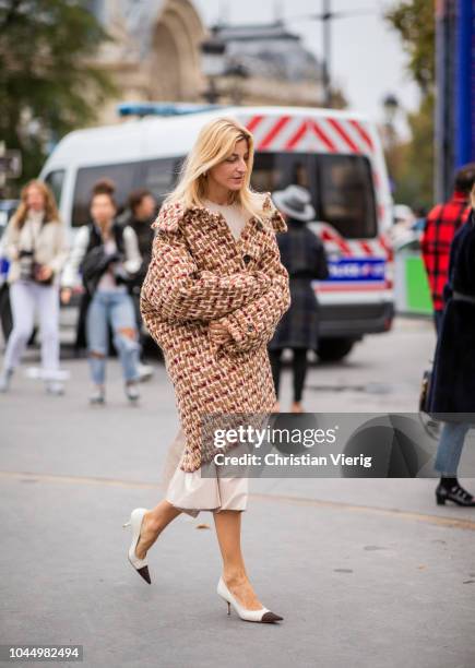 Ada Kokosar wearing tweed coat is seen outside Chanel during Paris Fashion Week Womenswear Spring/Summer 2019 on October 2, 2018 in Paris, France.