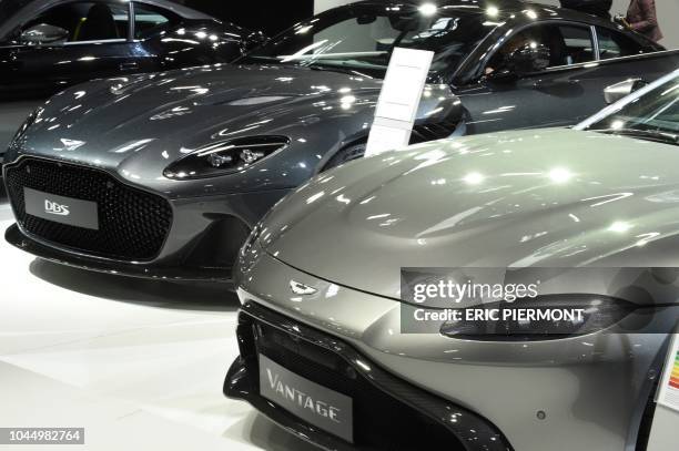 Aston Martin cars are presented at the Aston Martin stand during the press days of the Paris Motor Show on October 3, 2018. - Aston Martin on October...