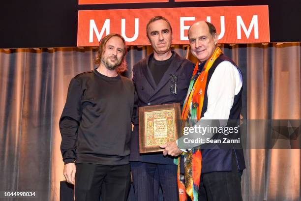 Sterling Ruby, Raf Simons and Monty Blanchard attend the American Folk Art Museum Fall Benefit Gala 2018 at The Ziegfeld Ballroom on October 2, 2018...