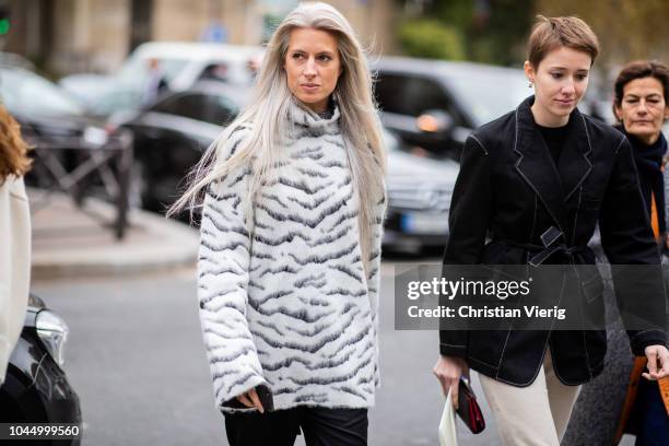 Sarah Harris wearing knit with animal print is seen outside Miu Miu during Paris Fashion Week Womenswear Spring/Summer 2019 on October 2, 2018 in...