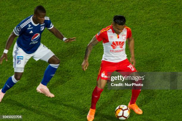 Wilson Morelo of Independiente Santa Fe defends the ball against a Millonarios player. On 3 October 2018 at Estadio Nemesio Camacho in Bogota,...