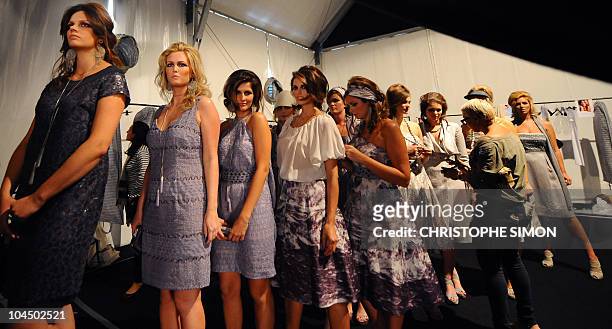 Models get ready backstage prior the Elena Miro spring-summer 2011ready-to-wear collection on September 22, 2010 during the Women's fashion week in...