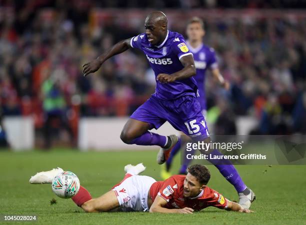 Bruno Martins of Stoke City is tackled by Matty Cash of Nottingham Forest during the Carabao Cup Third Round match between Nottingham Forest and...