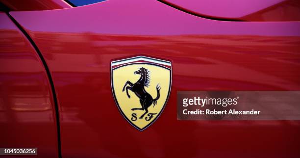 The famous logo for Ferrari automobiles is a black prancing horse on a yellow background, usually with the letters S and F, which stand for Scuderia...