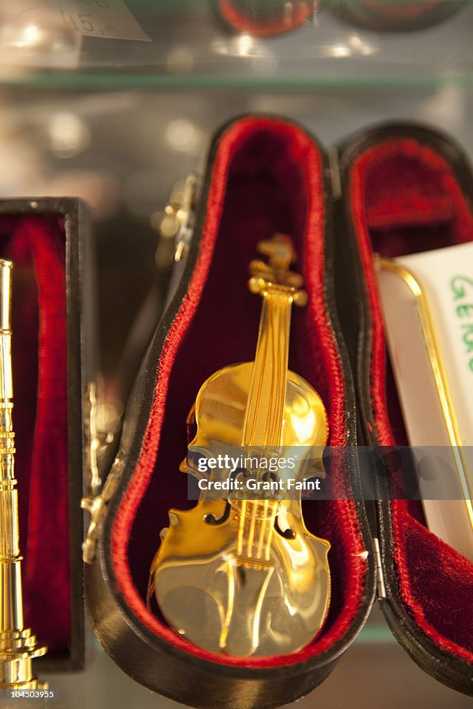 Mini Golden Instruments Mini Golden Toy Violin High-Res Stock Photo - Getty Images
