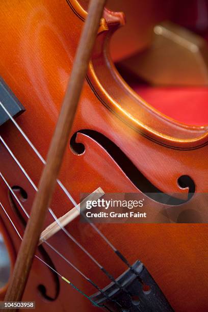 close up of violin being played - violin stock pictures, royalty-free photos & images