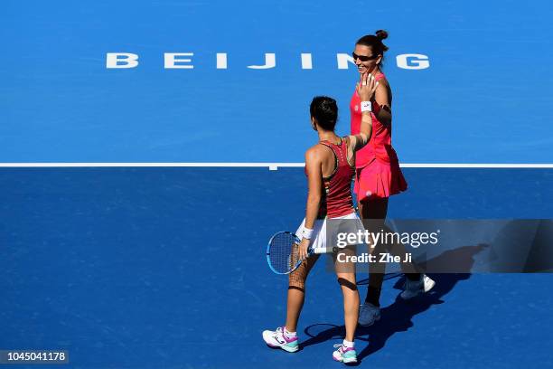 Lara Arruabarrena of Spain talk with Darija Jurak of Croatia against Nicole Melichar of The United States and Kveta Peschke of the Czech Republic...