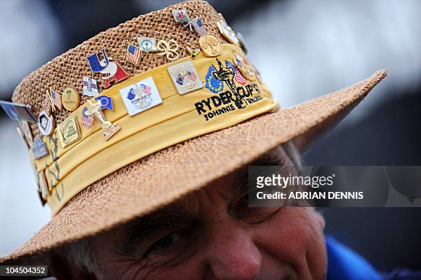 Golf marshall displays his hat during a practice session for the Europe and US teams at Celtic Manor golf course in Newport, Wales on September 28,...
