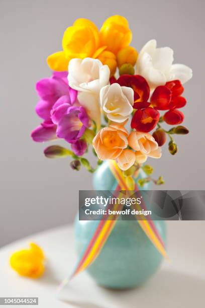 bouquet of colourful freesias - freesia flowers stock pictures, royalty-free photos & images