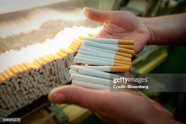 tobacco check Youth lead prevention efforts in Wisconsin An employee performs a quality