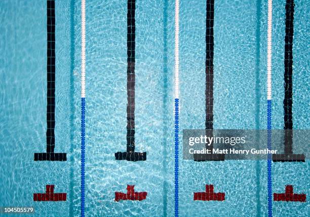 pool with swimmer lanes - swim competition stock pictures, royalty-free photos & images