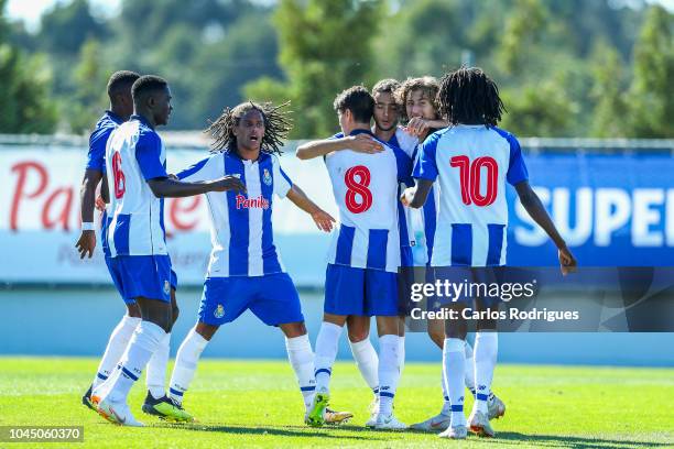 Joao Mario of FC Porto celebrates scoring FC Porto first goal with his team mates during the Group D match of the UEFA Champions League between FC...