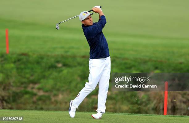 Rickie Fowler of the United States team plays his second shot on the ninth hole during the morning fourball matches of the 2018 Ryder Cup at Le Golf...